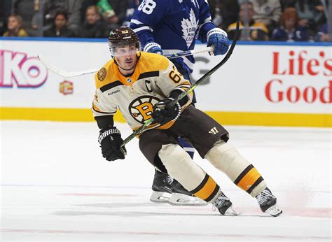 Marchand scores late in OT to lift Bruins to 4-3 win over Maple Leafs